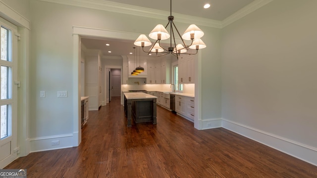 10765 Shallowford Rd, Roswell, GA 30075 - kitchen with a chandelier, dark wood-style flooring, a center island, light countertops, and a breakfast bar