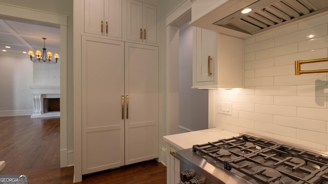 10765 Shallowford Rd, Roswell, GA 30075 - kitchen with backsplash, dark wood-style flooring, a chandelier, range, and custom exhaust hood