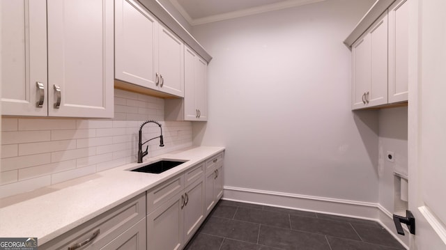 10765 Shallowford Rd, Roswell, GA 30075 - washroom featuring cabinet space, dark tile patterned floors, crown molding, and electric dryer hookup