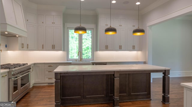 10765 Shallowford Rd, Roswell, GA 30075 - kitchen featuring range with two ovens, custom range hood, backsplash, white cabinets, and dark wood-style floors