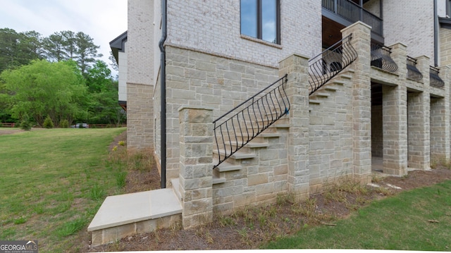 10765 Shallowford Rd, Roswell, GA 30075 - view of property exterior featuring stairway, brick siding, and a lawn