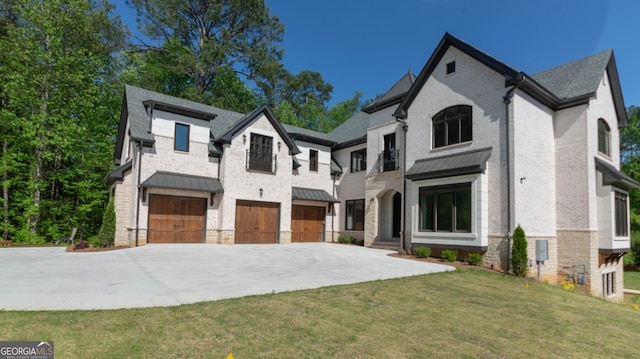 10765 Shallowford Rd, Roswell, GA 30075 - french country style house featuring a standing seam roof, a garage, driveway, a front yard, and stone siding