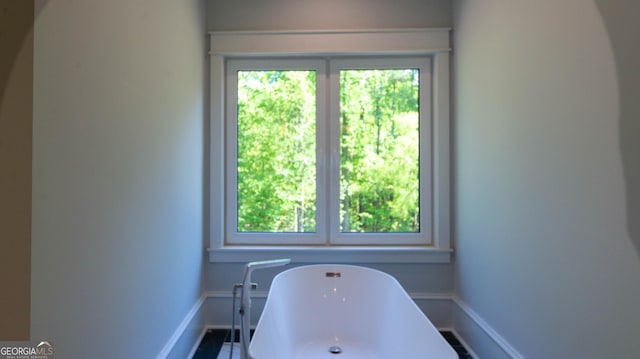 10765 Shallowford Rd, Roswell, GA 30075 - full bath featuring a freestanding bath and baseboards