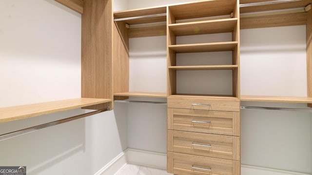 10765 Shallowford Rd, Roswell, GA 30075 - walk in closet featuring light marble finish floors
