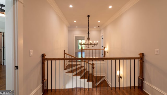 10765 Shallowford Rd, Roswell, GA 30075 - stairs with wood finished floors, crown molding, a chandelier, and recessed lighting
