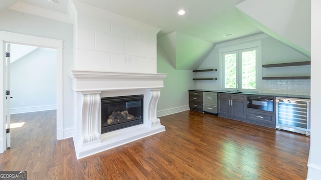 10765 Shallowford Rd, Roswell, GA 30075 - unfurnished living room featuring beverage cooler, dark wood-type flooring, a glass covered fireplace, recessed lighting, and ornamental molding