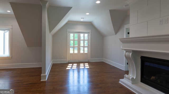 10765 Shallowford Rd, Roswell, GA 30075 - additional living space featuring dark wood-type flooring, vaulted ceiling, a glass covered fireplace, and recessed lighting