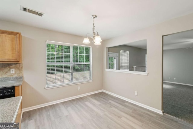 2896 Chilhowee Dr, Atlanta, GA 30331 - unfurnished dining area featuring healthy amount of natural light, a chandelier, light wood-type flooring, and baseboards