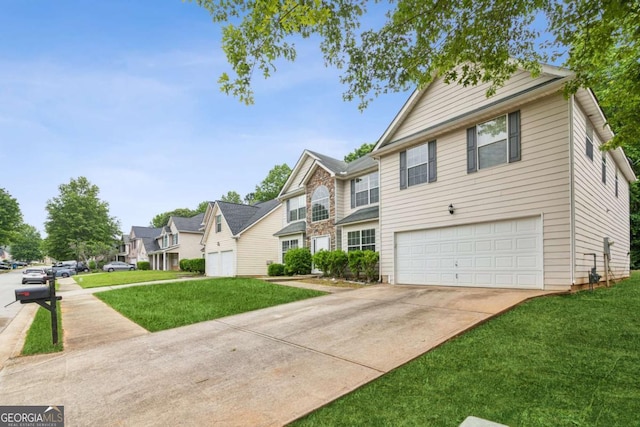 2896 Chilhowee Dr, Atlanta, GA 30331 - view of front of property featuring an attached garage, concrete driveway, a front lawn, and a residential view