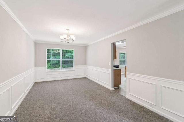 2896 Chilhowee Dr, Atlanta, GA 30331 - unfurnished room featuring a chandelier, crown molding, a wainscoted wall, a decorative wall, and dark carpet