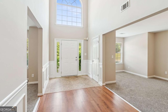 2896 Chilhowee Dr, Atlanta, GA 30331 - foyer entrance featuring wood finished floors, carpet flooring, and a high ceiling