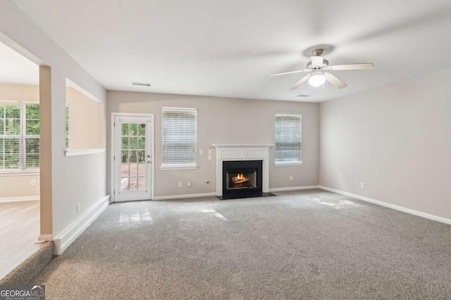 2896 Chilhowee Dr, Atlanta, GA 30331 - unfurnished living room with carpet floors, a fireplace with flush hearth, a ceiling fan, and baseboards