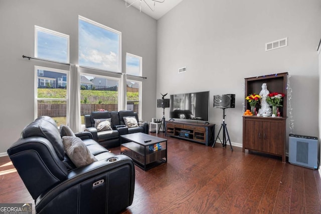 4607 Underwood Walk, Powder Springs, GA 30127 - living room with a high ceiling, wood finished floors, and baseboards