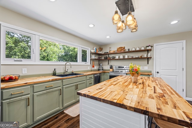 kitchen with wood counters, green cabinets, a sink, appliances with stainless steel finishes, and open shelves