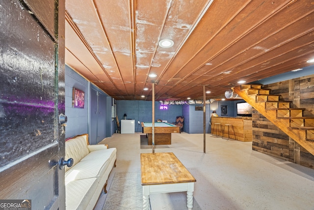 finished basement featuring pool table and stairs