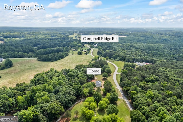 drone / aerial view of a heavily wooded area