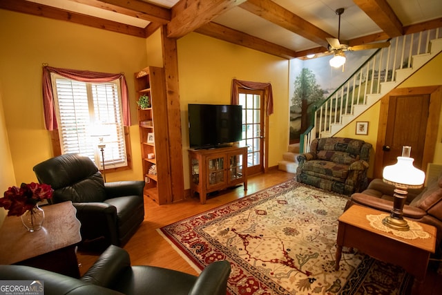 3530 Refuge Rd, Jasper, GA 30143 - living area with wood finished floors, beamed ceiling, ceiling fan, and stairs