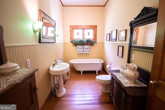 3530 Refuge Rd, Jasper, GA 30143 - full bathroom featuring wainscoting, wood-type flooring, a freestanding bath, ornamental molding, and toilet