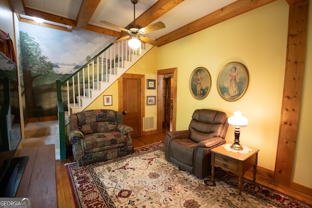 3530 Refuge Rd, Jasper, GA 30143 - living room with wood finished floors, beamed ceiling, ceiling fan, and stairway