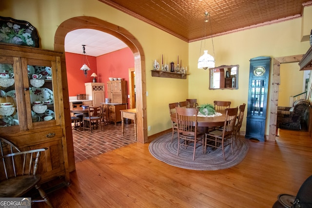 3530 Refuge Rd, Jasper, GA 30143 - dining area featuring wood finished floors, arched walkways, ornamental molding, baseboards, and an ornate ceiling