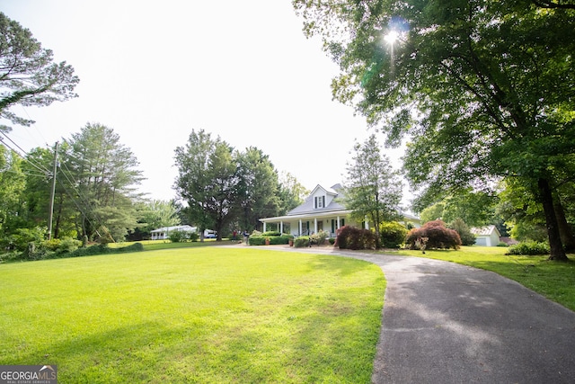 3530 Refuge Rd, Jasper, GA 30143 - view of front of house featuring a front yard, asphalt driveway, and a porch