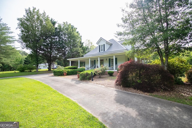 3530 Refuge Rd, Jasper, GA 30143 - view of front of property with covered porch, a front yard, metal roof, and driveway