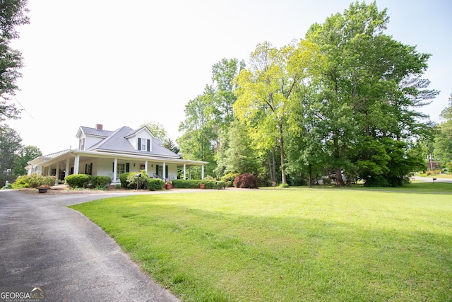 3530 Refuge Rd, Jasper, GA 30143 - farmhouse inspired home featuring a front lawn, covered porch, and a chimney