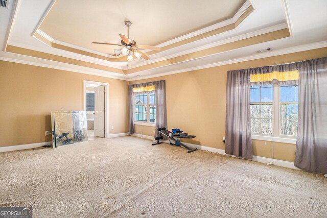 145 Windward Hls, Mcdonough, GA 30253 - exercise room featuring a tray ceiling, ornamental molding, a ceiling fan, carpet, and baseboards