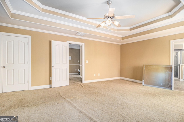 145 Windward Hls, Mcdonough, GA 30253 - unfurnished bedroom with a tray ceiling, carpet floors, crown molding, and baseboards