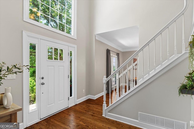 235 Foxley Way, Roswell, GA 30075 - foyer entrance featuring stairs, a towering ceiling, plenty of natural light, wood finished floors, and baseboards