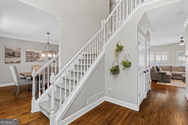235 Foxley Way, Roswell, GA 30075 - staircase featuring wood finished floors, crown molding, baseboards, a ceiling fan, and a chandelier