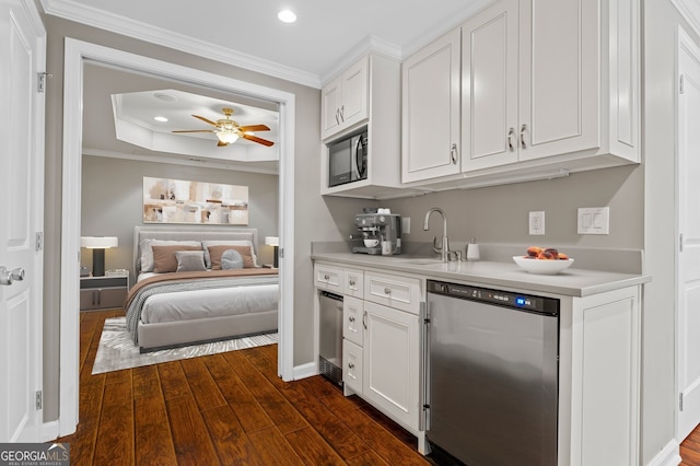235 Foxley Way, Roswell, GA 30075 - kitchen with a sink, dishwashing machine, crown molding, light countertops, and dark wood finished floors
