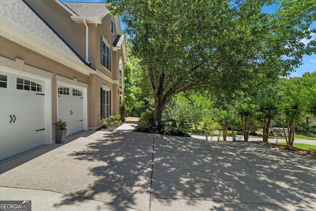 235 Foxley Way, Roswell, GA 30075 - view of side of home with stucco siding and driveway