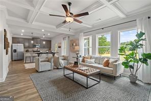 2700 Westgate Park Dr Unit 1A, Loganville, GA 30052 - living room with coffered ceiling, beamed ceiling, light wood-type flooring, ceiling fan, and recessed lighting