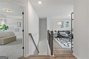2700 Westgate Park Dr Unit 1A, Loganville, GA 30052 - hall featuring an upstairs landing, wood finished floors, recessed lighting, and baseboards