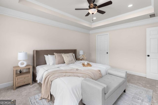 bedroom with light colored carpet, a raised ceiling, ornamental molding, recessed lighting, and baseboards