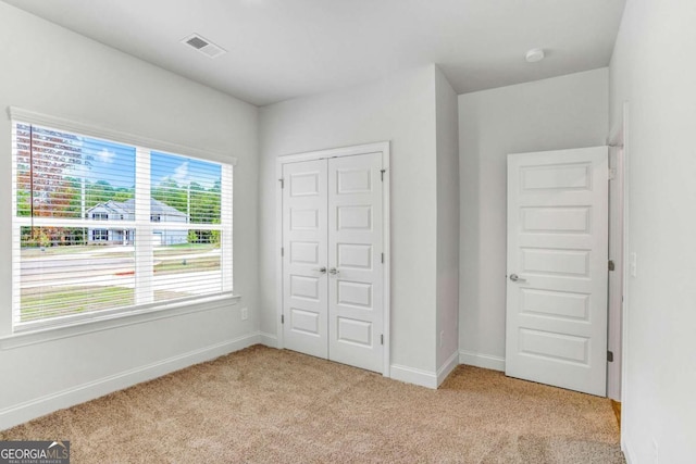 34 Cooper Dr Unit 53, Mansfield, GA 30055 - unfurnished bedroom featuring light colored carpet and a closet