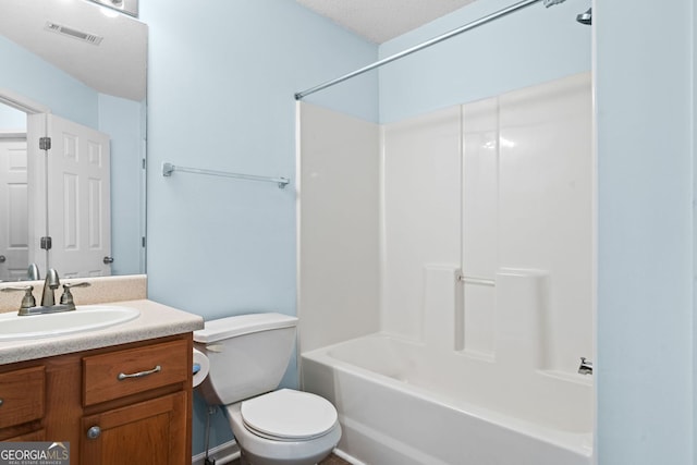 bathroom featuring vanity, toilet, and  shower combination