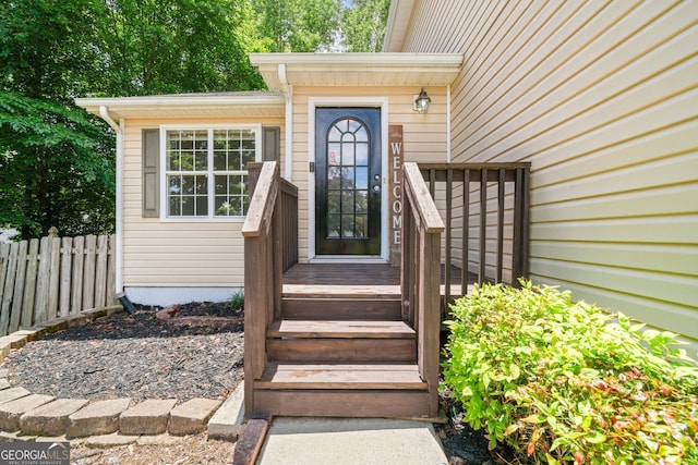 doorway to property with fence