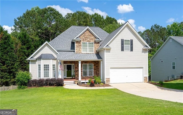 59 Creekside Blf, Hiram, GA 30141 - view of front facade with stone siding, driveway, an attached garage, a porch, and a front lawn