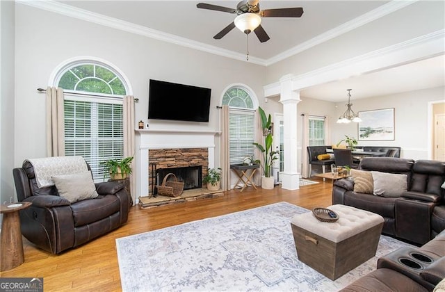 59 Creekside Blf, Hiram, GA 30141 - living room with ornate columns, ceiling fan, plenty of natural light, crown molding, and light wood-style flooring