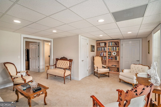 127 Courts Of Hampton, Hampton, GA 30228 - living area featuring carpet floors, recessed lighting, a paneled ceiling, and built in features