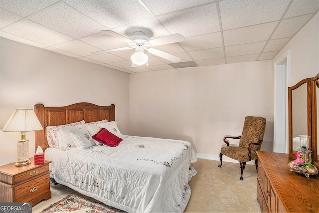 127 Courts Of Hampton, Hampton, GA 30228 - bedroom featuring light carpet, a paneled ceiling, and a ceiling fan