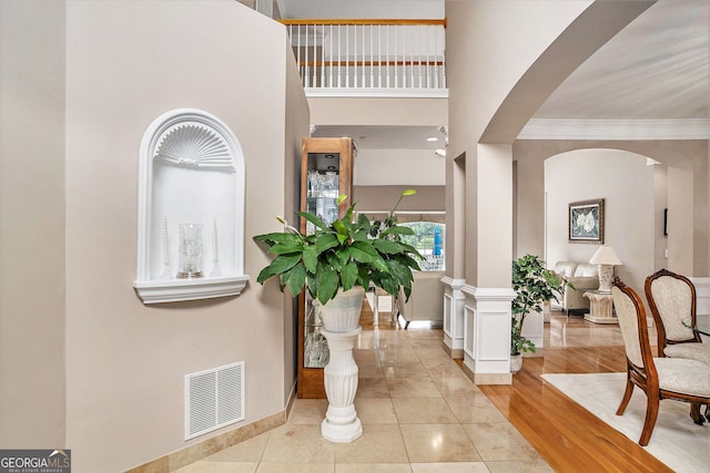 127 Courts Of Hampton, Hampton, GA 30228 - foyer with arched walkways, ornamental molding, and a towering ceiling