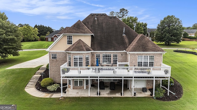 127 Courts Of Hampton, Hampton, GA 30228 - rear view of property with brick siding, a patio area, a wooden deck, and a lawn