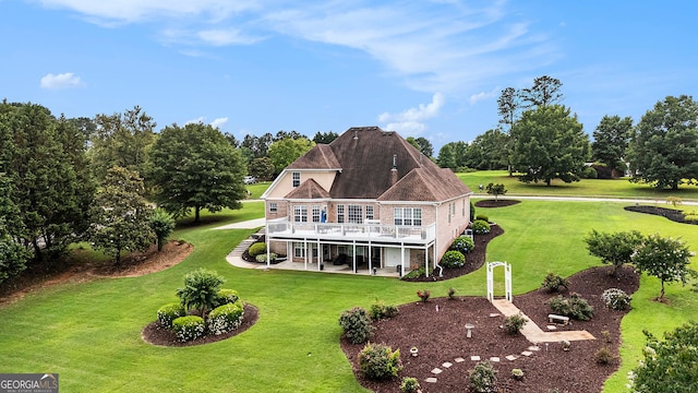 127 Courts Of Hampton, Hampton, GA 30228 - rear view of house with a deck, a patio area, a lawn, and view of wooded area