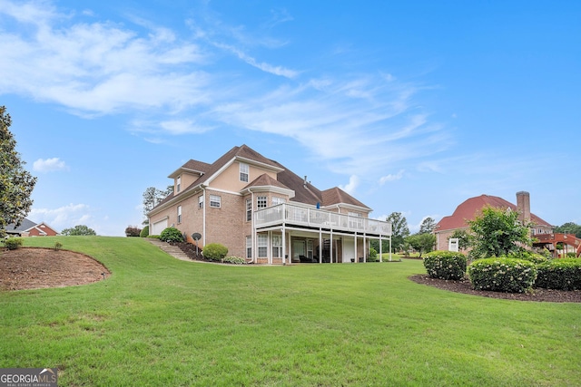 127 Courts Of Hampton, Hampton, GA 30228 - rear view of house featuring a lawn, a wooden deck, and brick siding