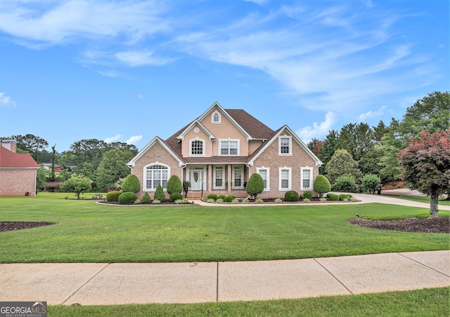 127 Courts Of Hampton, Hampton, GA 30228 - traditional home with brick siding and a front lawn