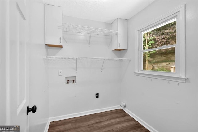 washroom featuring washer hookup, dark wood-type flooring, baseboards, and electric dryer hookup