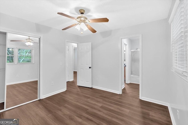 unfurnished bedroom featuring wood finished floors, baseboards, and ceiling fan